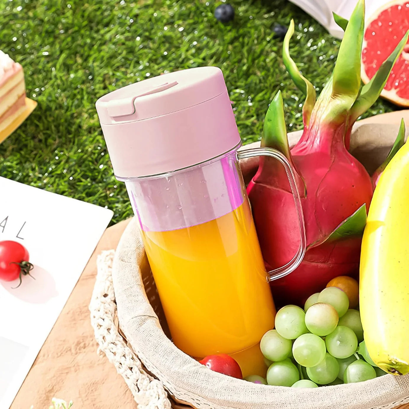 Hand holding pink portable blender bottle filled with a smoothie